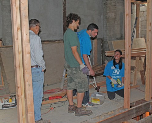 People working on building house